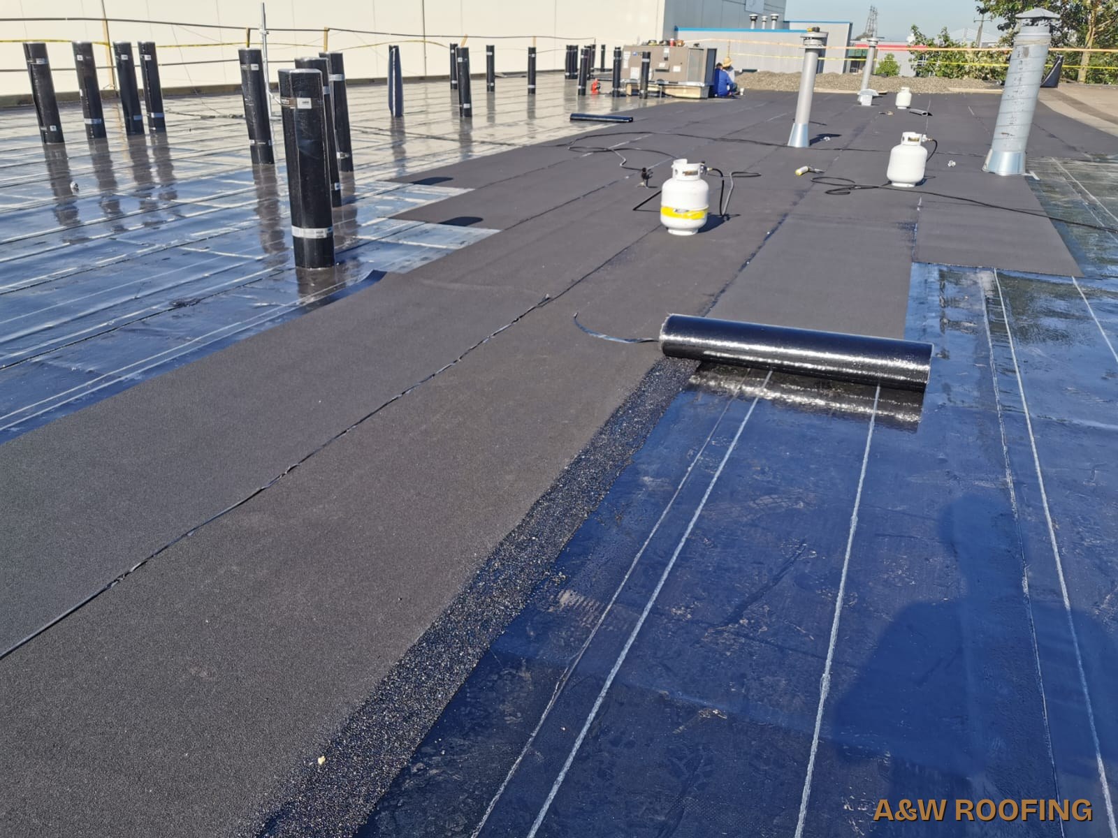 A&W Roofing Ltd commercial torch-on flat roof installation, South Surrey roofing contractor