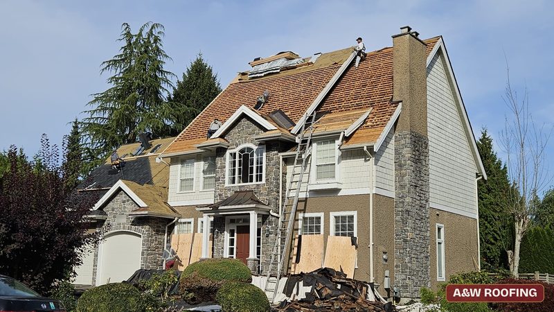 Cedar shake tear-off in progress, roof replacement in South Surrey by A&W Roofing Ltd