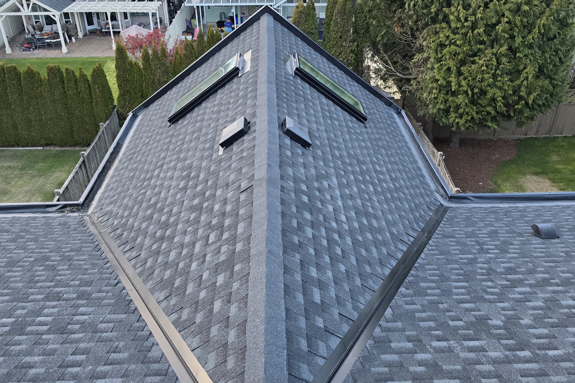 Finished shingle roof with skylights, completed by A&W Roofing in Vancouver
